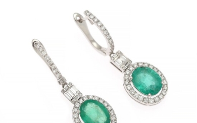 A pair of emerald and diamond ear pendants each set with an emerald weighing app. 3.25 ct. and diamonds weighing app. 0.85 ct., mounted in white gold.