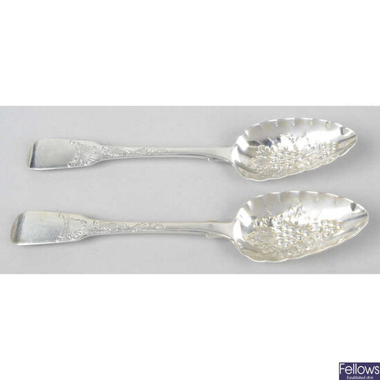 A pair of late George III silver 'berry' table spoons in Fiddle pattern.