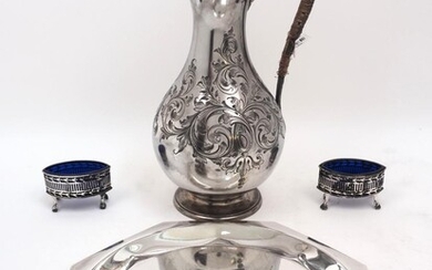 A pair of silver salts, Birmingham, 1918, William Hutton & Sons Ltd, of pierced navette form with blue glass liners, 8.2cm wide, together with a Victorian silver plated ewer, with hinged lid and floral decoration, stamped Lambert, Coventry Street...