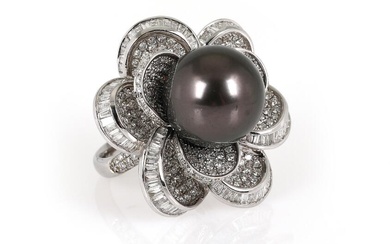 A pearl and diamond ring set with a Tahiti cultured pearl encircled...