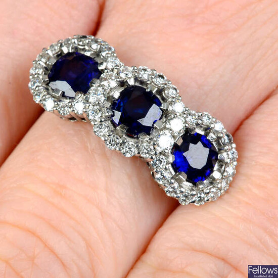 A platinum sapphire and brilliant-cut diamond triple cluster ring.