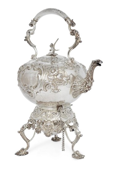 A silver hot water kettle with stand and burner, London, 1859, Robert Harper, the round kettle designed with repousse floral scroll body, zoomorphic spout and bird finial to lid, the fixed handle with ivory spacers, 26cm high (exc. stand), 38.5cm...