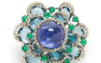 A tanzanite, blue topaz, emerald and diamond ring