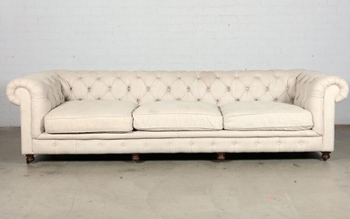 A tufted woven upholstered Chesterfield sofa