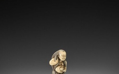 AN EXQUISITE IVORY NETSUKE OF A DIVING GIRL (AMA)