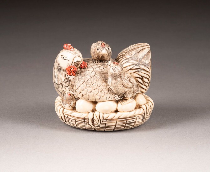 AN IVORY CARVED 'HEN AND CHICKEN'