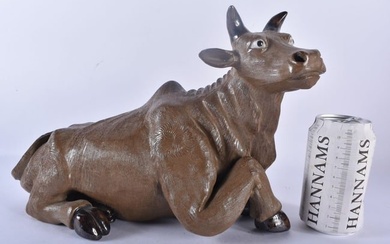 AN UNUSUAL LATE 19TH CENTURY CHINESE CARVED POTTERY FIGURE OF A RECUMBENT BULL Late Qing. 32 cm x 24
