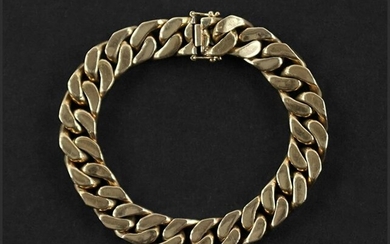 An 18 Karat Yellow Gold Curb Link Bracelet.