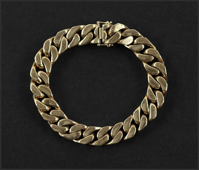 An 18 Karat Yellow Gold Curb Link Bracelet.