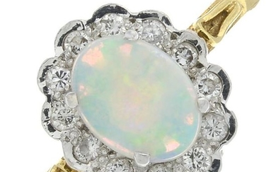 An 18ct gold opal and diamond cluster ring.Estimated...