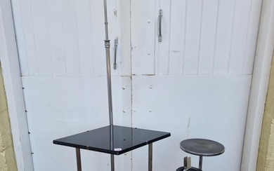 An Art Deco chrome and ebonized adjustable lamp table; ...