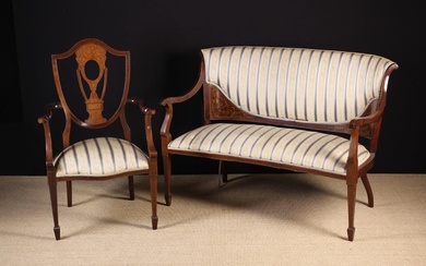 An Edwardian Inlaid Mahogany Settee & Armchair. The settee having an upholstered back curved in at t