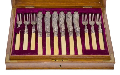 An Edwardian canteen of silver fish knives and forks, London,...