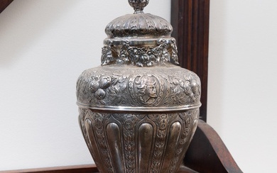 An English hallmarked sterling silver and embossed lidded urn with art nouveau design. Height 22.5cm, wt. 475g
