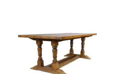 An English oak refectory dining table, first half 20th century, the plank...