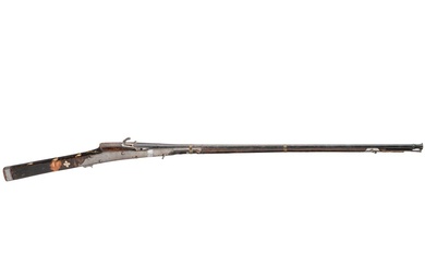 An Indian matchlock gun, 19th century Canon lisse bruni, bouche canonnée de calibre 13 mm,...