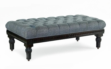 An Upholstered Tufted Ottoman.