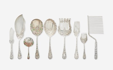 An assembled group of nine sterling silver floral repousse serving utensils, various makers