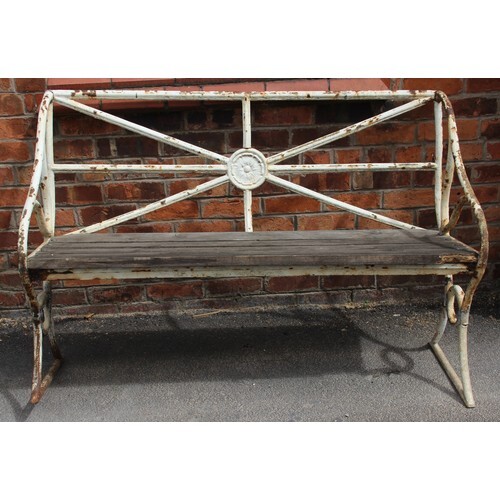 An early 19th century painted iron garden bench, the rail ba...