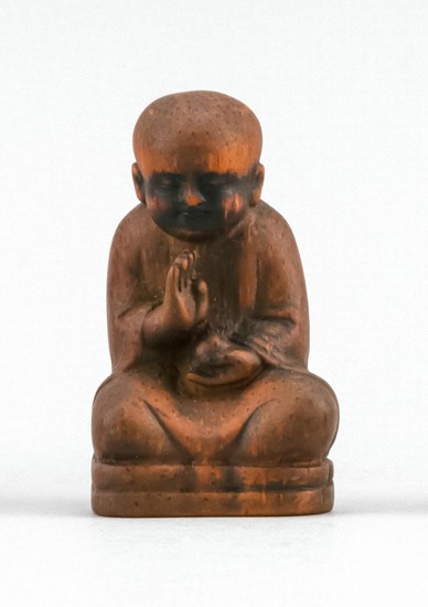 CHINESE CARVED BAMBOO FIGURE In the form of a seated monk. Seven-character seal carved in base. Height 3".