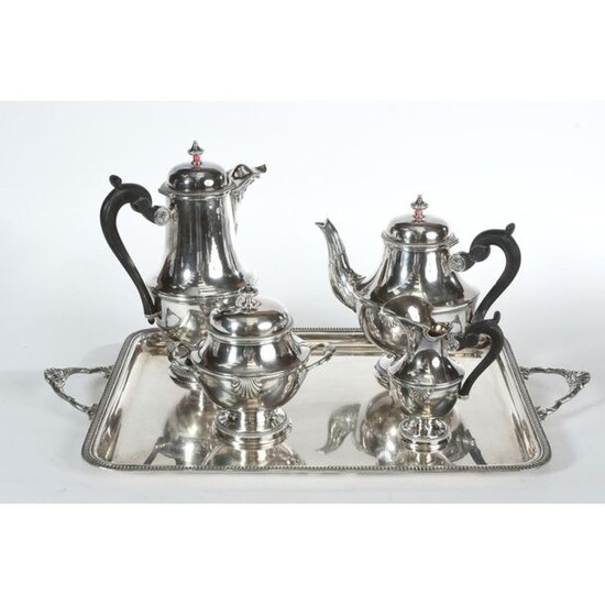 COFFEE SERVICE in solid silver on its tray. Shell model. Gadrooned rim. The 4 solid silver pieces make a total of 2kgs150 and the tray is in silver plated metal.