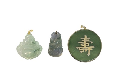 Chinese Circa 1950 A group of three jadeite pendants Includi...