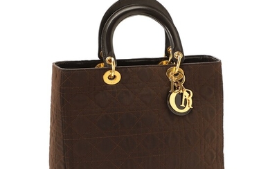 NOT SOLD. Christian Dior: A "Lady Dior" bag made of dark brown with gold toned...
