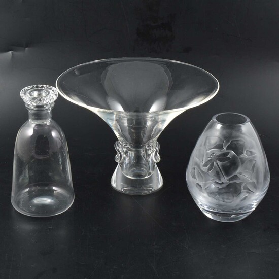 Daum decanter, Steuben Studio Glass vase, and another glass vase.