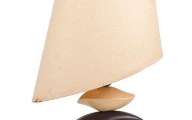 Drimmer, a French ceramic lamp, c.1980, the lamp base comprising three stacked ceramic abstract forms, with shaped shade, applied manufacturer's label to base, 38cm high, 50cm high including shade