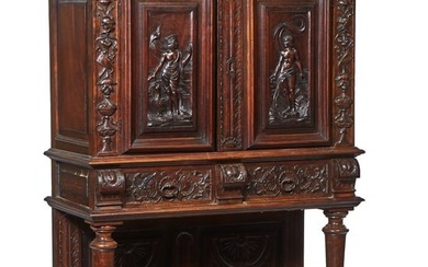 French Renaissance Revival Carved Walnut Court Cupboard, late 19th c., the flat stepped top over an