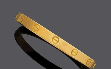 GOLD BANGLE, BY CARTIER.