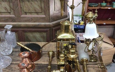 Good collection of copper and brassware, including graduated jugs, oil lamps, etc