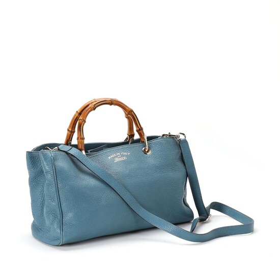 SOLD. Gucci: A "Bamboo Shopper Tote" of blue leather, gold tone hardware, two handles of bamboo and a detachable and adjustable shoulder strap. – Bruun Rasmussen Auctioneers of Fine Art