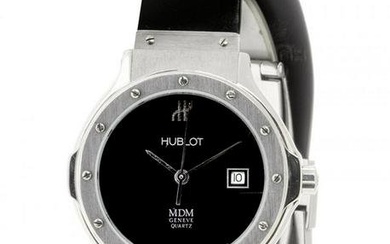 HUBLOT MDM watch, n. 189961. In steel. Circular black dial with spearhead hands and central seconds