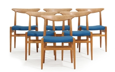 Hans J. Wegner: “W2”. A set of six solid oak chairs, upholstered in seats with blue fabric. Manufactured by C.M. Madsen. (6)