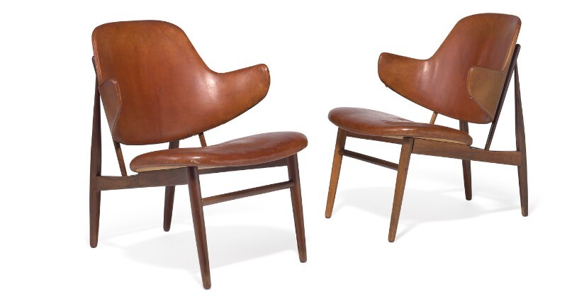 Ib Kofod-Larsen: A pair of Brazilian rosewood lounge chairs. Seat and back upholstered with original, patinated leather. Model DP 9. (2)