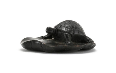 JAPANESE WOOD NETSUKE In the form of a turtle on a lily pad. Signed. Length 2.5".