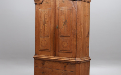 JOHANNES FUNDBERG. A hall cabinet, oak with intarsia and carved decoration, Dalsland, 1830/40s.