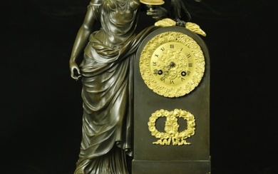 Large French Empire figural patinated and gilt bronze mantel clock