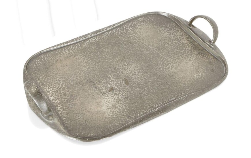 Liberty & Co., Tudric tray, model no.043, circa 1901, Hammered pewter, Underside stamped 'MADE/IN/ENGLAND', 'TUDRIC', '043', and crossed acorn mark for 'Solkets' (W.H. Haseler), 48cm x 29.3cm