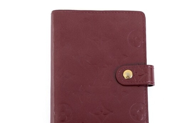 NOT SOLD. Louis Vuitton: An "Agenda Cover" of burgundy monogram Vernis leather with two inner...