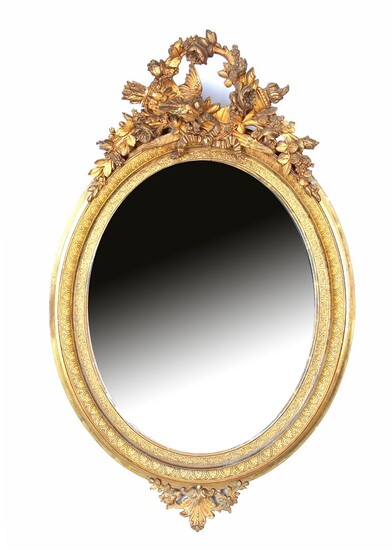 (-), Oval facet cut mirror in richly decorated...