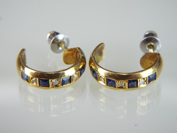 Pair of 18ct earrings set with Diamonds and Sapphires.