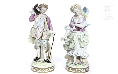 Pair of European porcelain figurines, 20th century