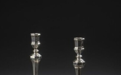 Pair of silver torches with cut-off sides, the baluster shaft...