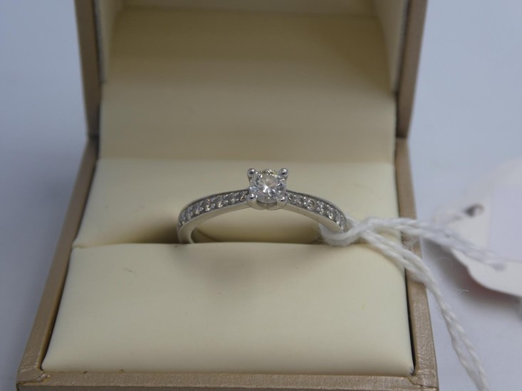 Platinum & diamond ring with central 4 claw set solitaire di...