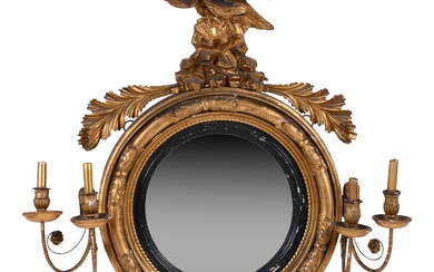REGENCY PARCEL-EBONIZED GILTWOOD AND COMPOSITION CONVEX MIRROR, LATE 19TH CENTURY 33 x 36 in. (83.8 x 91.4 cm.)