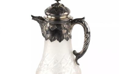Silver water jug with engraved glass.