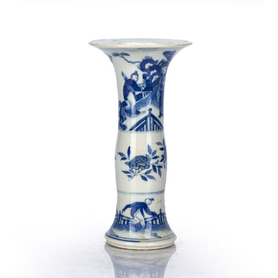 Small blue and white beaker vase