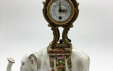 Stone clock with a sculptural image of an elephant
